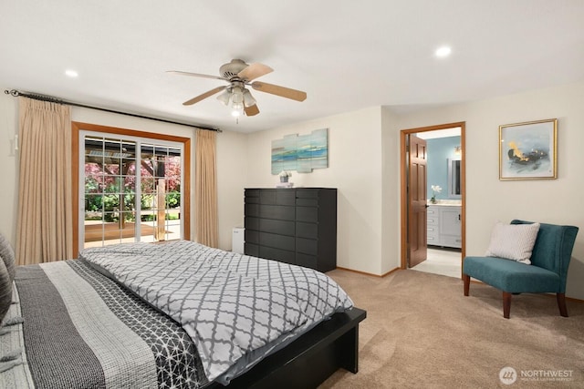 bedroom featuring ceiling fan, ensuite bathroom, light colored carpet, baseboards, and access to outside