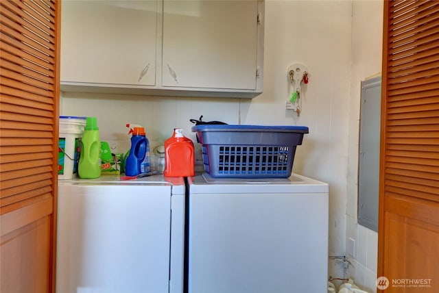 laundry area featuring washer and dryer and cabinet space