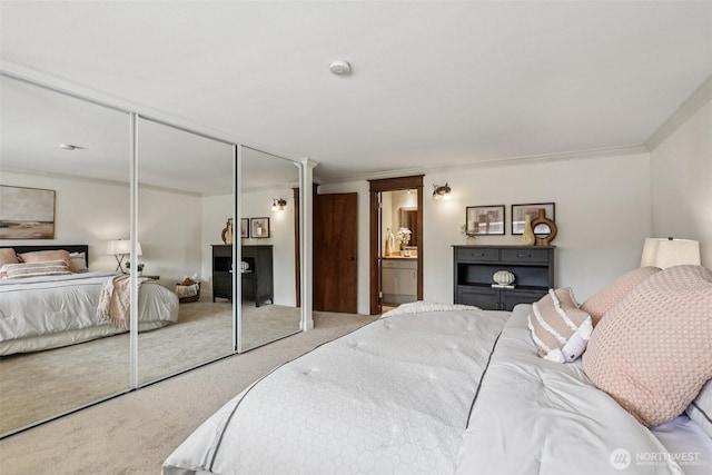 300 N 137th St Unit C, Seattle, WA 98133 - bedroom with carpet, a closet, connected bathroom, and crown molding