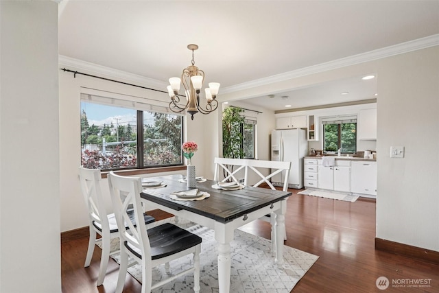 300 N 137th St Unit C, Seattle, WA 98133 - dining room with a chandelier, crown molding, and dark wood-style flooring