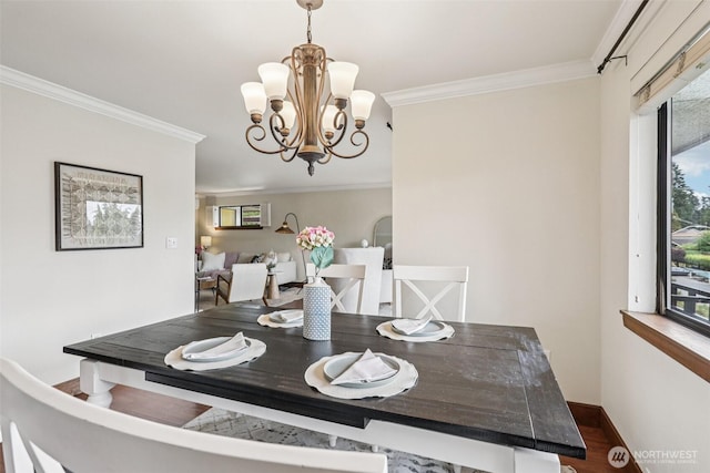 300 N 137th St Unit C, Seattle, WA 98133 - dining space featuring crown molding, a chandelier, and wood finished floors