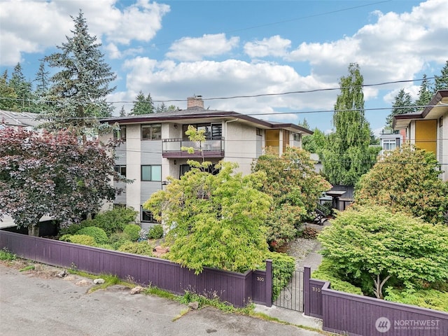 300 N 137th St Unit C, Seattle, WA 98133 - view of building exterior featuring a fenced front yard