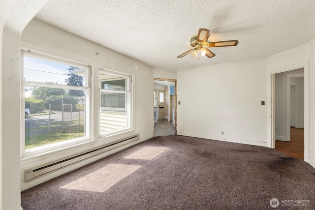 carpeted empty room featuring a baseboard radiator, a textured ceiling, and ceiling fan