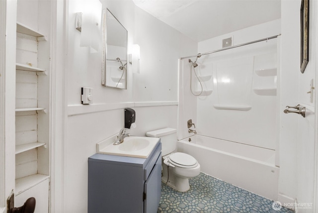 full bathroom with toilet, vanity, and washtub / shower combination