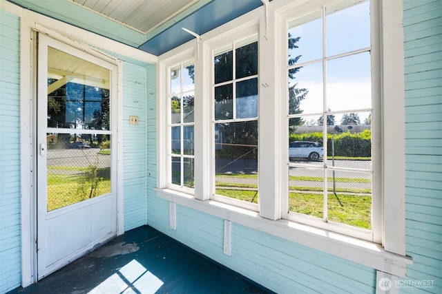 unfurnished sunroom with a healthy amount of sunlight