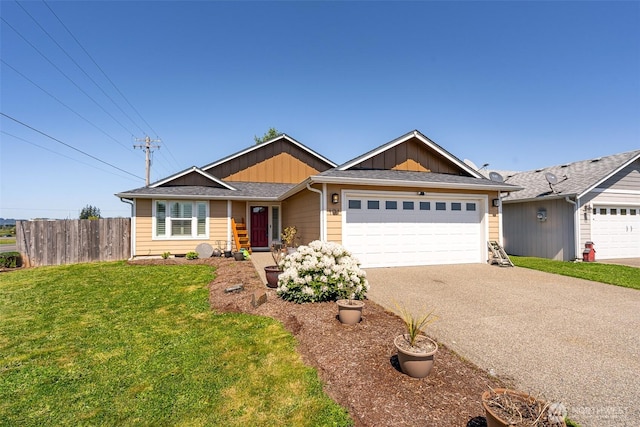 101 Holloway Dr, Chehalis, WA 98532 - view of front of house with fence, driveway, a garage, a front lawn, and board and batten siding