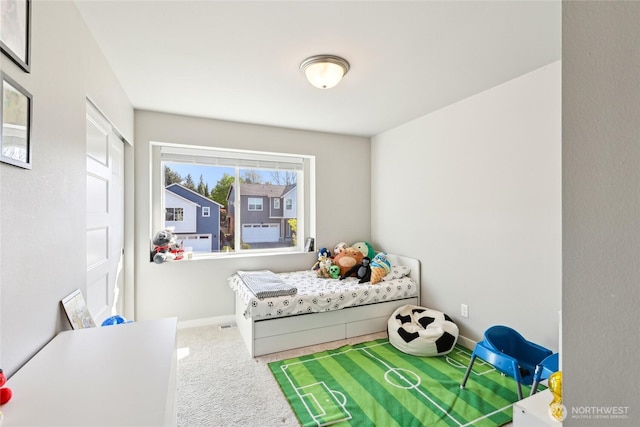bedroom with baseboards and carpet flooring