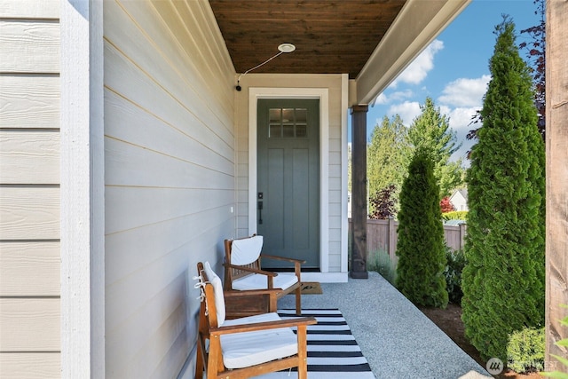 entrance to property featuring fence