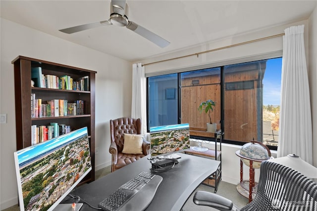 home office featuring ceiling fan and baseboards