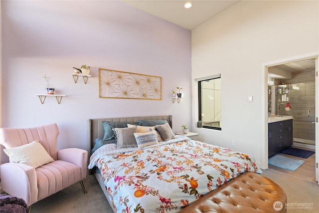 carpeted bedroom featuring recessed lighting and ensuite bathroom