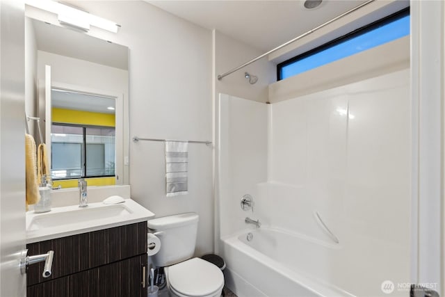 full bathroom with toilet, vanity, and tub / shower combination