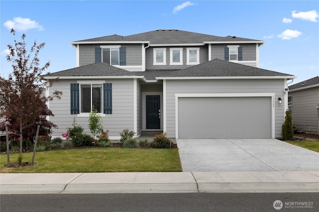 13509 197th St E, Graham, WA 98338 - view of front of house with a garage, driveway, a front lawn, and roof with shingles