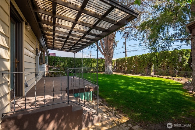 view of yard with fence, a pergola, and a patio