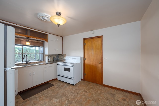 kitchen with electric stove, decorative backsplash, white cabinetry, and a sink