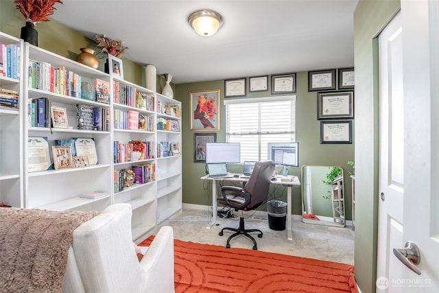 carpeted office space with baseboards