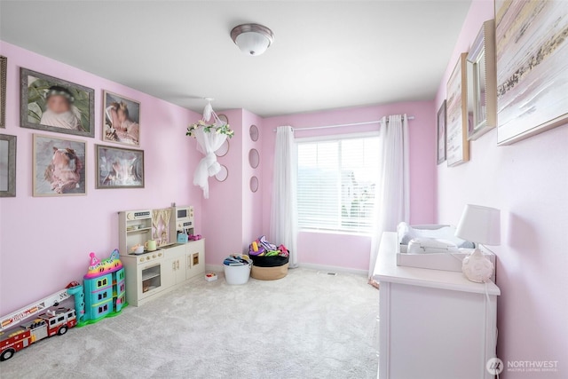 game room featuring baseboards and carpet