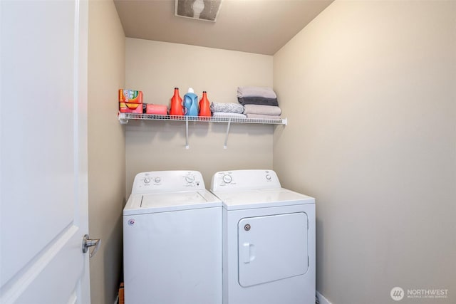 laundry area featuring laundry area and washer and clothes dryer