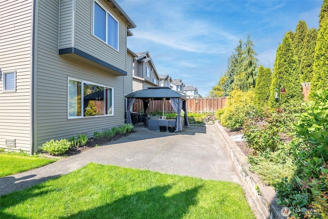 exterior space with a gazebo, a patio area, and fence