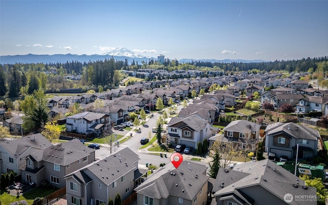 birds eye view of property featuring a residential view and a mountain view