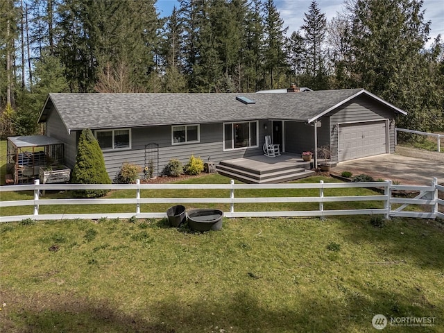27709 293rd Ave SE, Ravensdale, WA 98051 - ranch-style home featuring an attached garage, driveway, a chimney, and a shingled roof