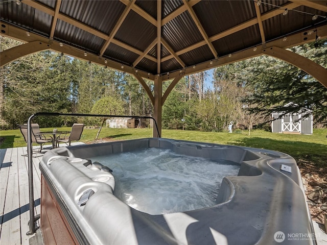 27709 293rd Ave SE, Ravensdale, WA 98051 - view of patio / terrace with a hot tub, a gazebo, an outdoor structure, a deck, and a storage unit