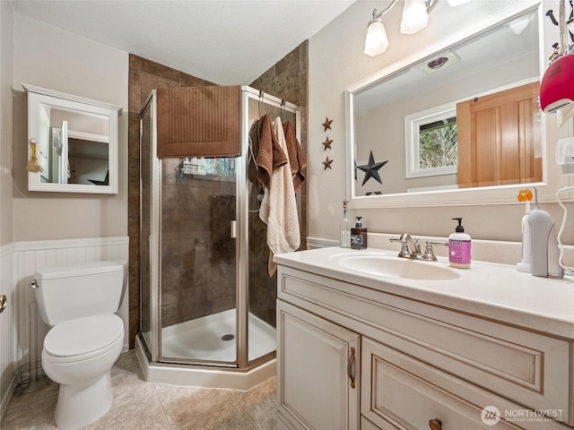 27709 293rd Ave SE, Ravensdale, WA 98051 - full bath featuring a shower stall, tile patterned flooring, toilet, and vanity