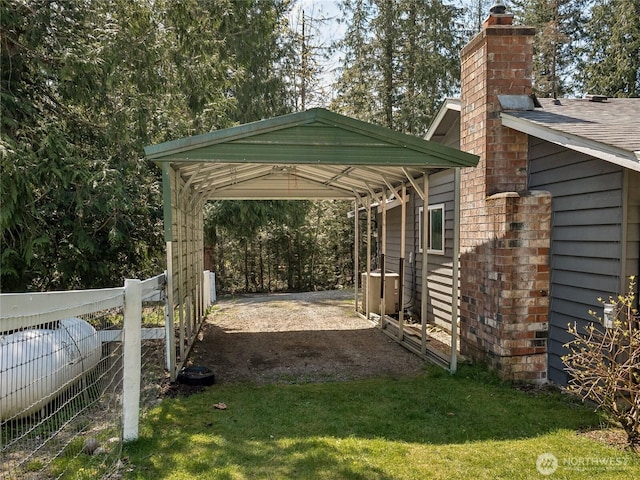 27709 293rd Ave SE, Ravensdale, WA 98051 - view of parking featuring a carport and dirt driveway