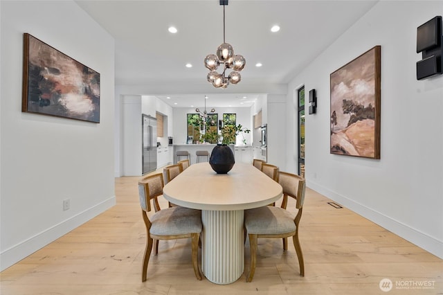 17720 SE 63rd Pl, Bellevue, WA 98006 - dining space with a chandelier, recessed lighting, and light wood-type flooring