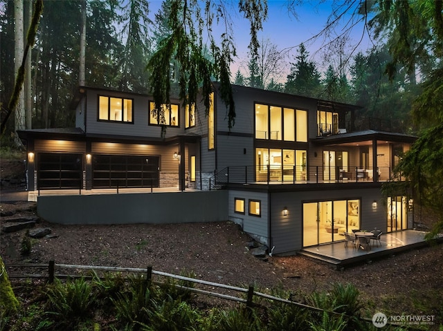 17720 SE 63rd Pl, Bellevue, WA 98006 - back of property at dusk with a balcony