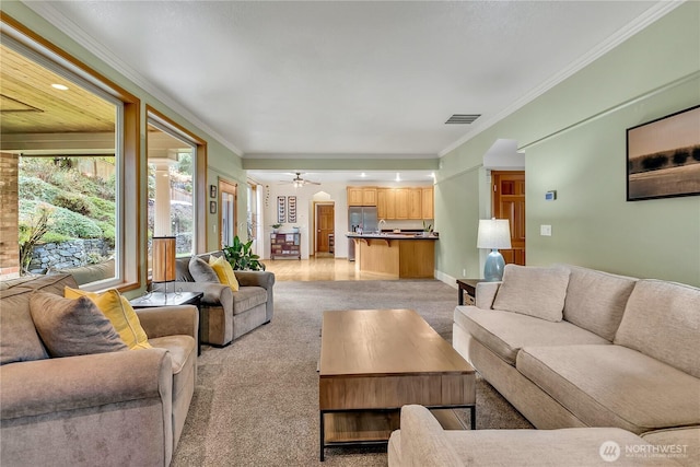 6725 Mirror Ct SE, Olympia, WA 98513 - living area with light carpet, visible vents, ornamental molding, and ceiling fan