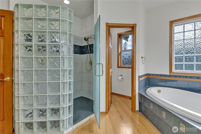 6725 Mirror Ct SE, Olympia, WA 98513 - bathroom featuring a bath, walk in shower, wood finished floors, and baseboards
