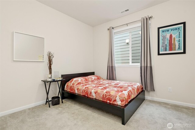 carpeted bedroom with baseboards and visible vents