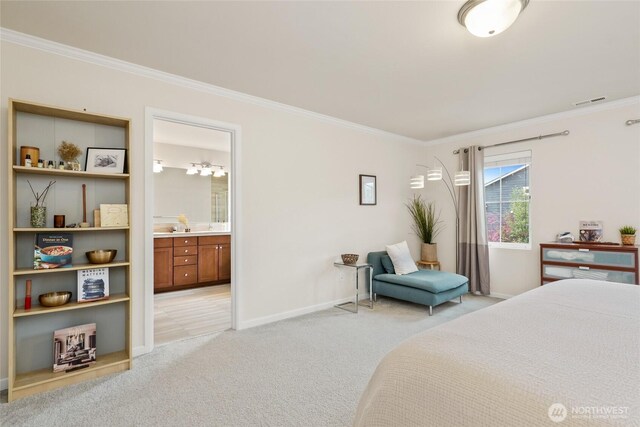 bedroom with baseboards, ornamental molding, connected bathroom, and light colored carpet