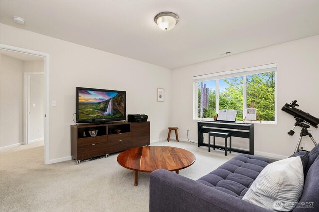 carpeted living room featuring baseboards and visible vents
