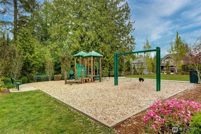 community jungle gym with a yard