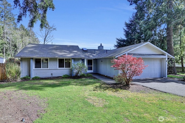 single story home with aphalt driveway, a front yard, fence, an attached garage, and a chimney