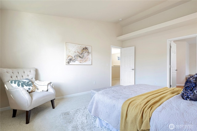 bedroom featuring light carpet, vaulted ceiling, and baseboards