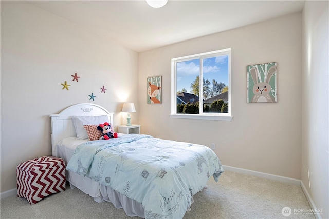 carpeted bedroom featuring baseboards