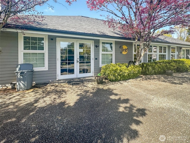 15415 35th Ave W Unit C304, Lynnwood, WA 98087 - doorway to property featuring a shingled roof and french doors