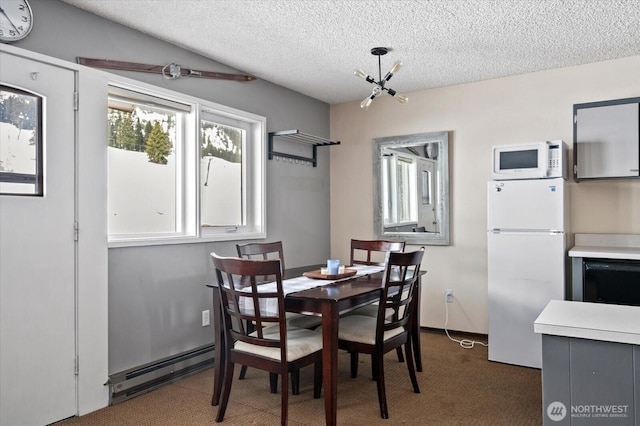 dining room featuring a textured ceiling, a baseboard heating unit, a notable chandelier, and carpet flooring