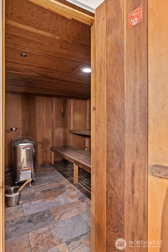 view of sauna featuring stone finish floor