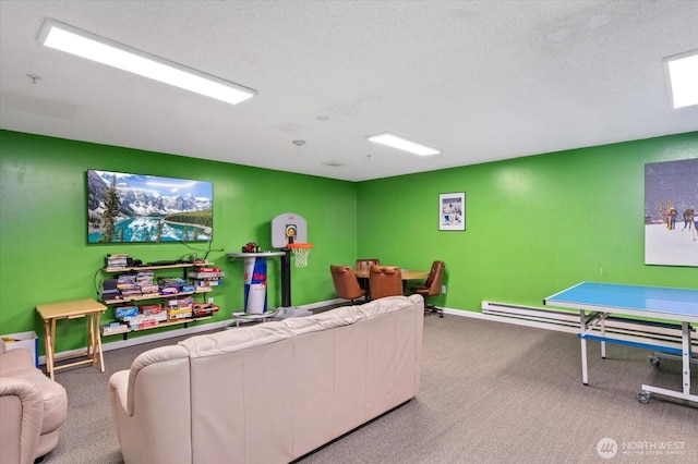 recreation room with carpet flooring and baseboards