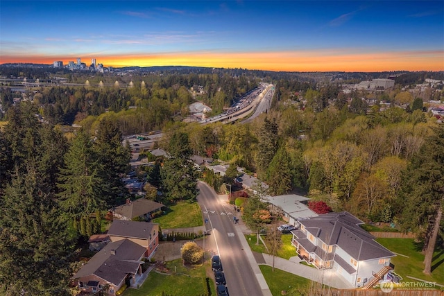 birds eye view of property with a forest view