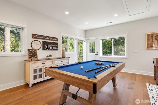 recreation room featuring light wood-type flooring, plenty of natural light, and baseboards
