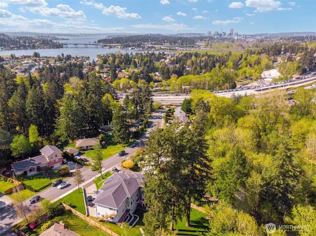 birds eye view of property with a water view