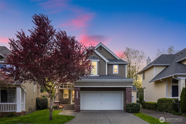 view of front of property with an attached garage, driveway, a front yard, brick siding, and a shingled roof