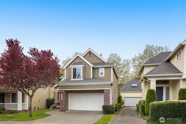 craftsman-style home with brick siding, a garage, a shingled roof, and concrete driveway