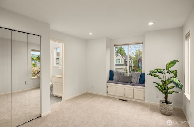 unfurnished room featuring light carpet, recessed lighting, and baseboards