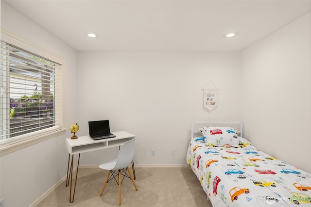carpeted bedroom with an office area, baseboards, and recessed lighting