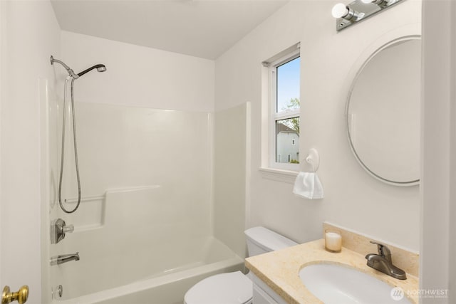 full bath featuring vanity, toilet, and shower / tub combination